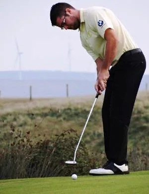 Cornwall's Tom Fox putts out at Royal North Devon image courtesy & copyright Chris Pountney